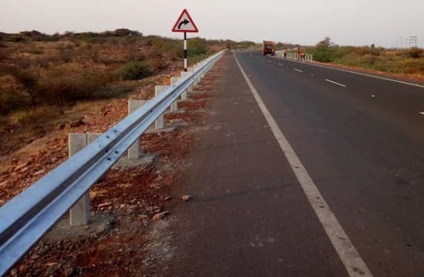 Crash Barriers - Highway-grade metal beam crash barriers providing critical protection on curves, bridges, medians, and highways.